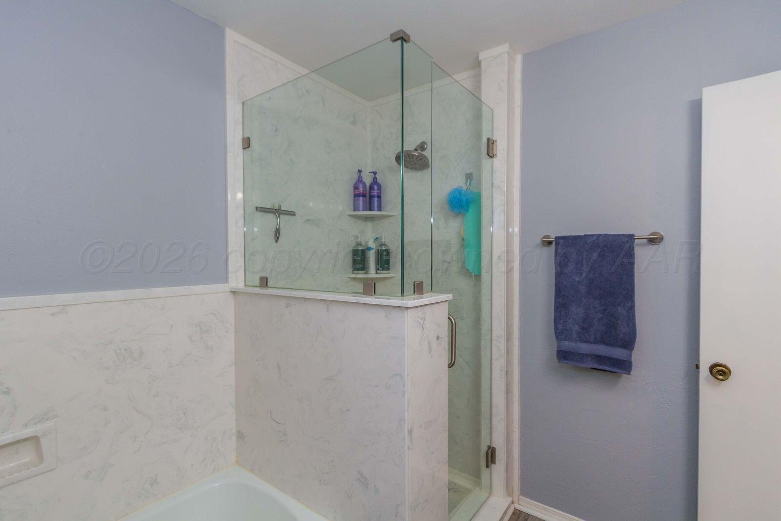 7612 Farrell Drive Amarillo, TX 79121 - Photo 17 of 27 a bathroom with a shower and a sink