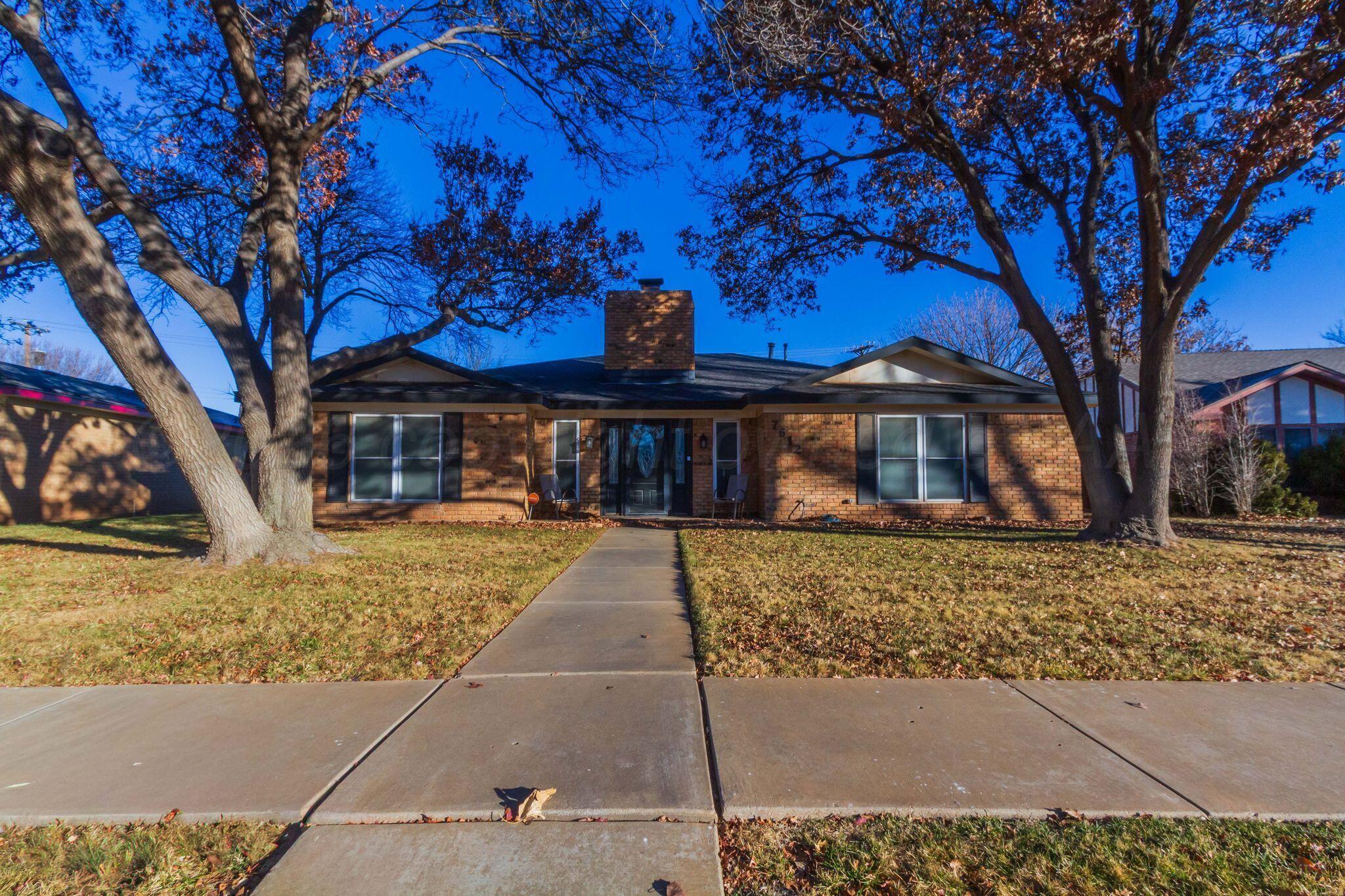 7612 Farrell Drive Amarillo, TX 79121 - Photo 2 of 27 a front view of a house with a garden
