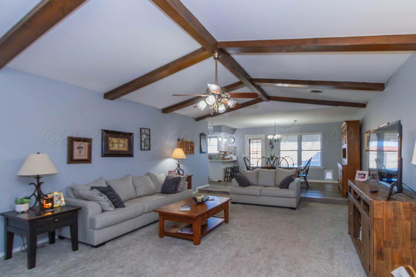 7612 Farrell Drive Amarillo, TX 79121 - Photo 7 of 27 a living room with furniture and a large window