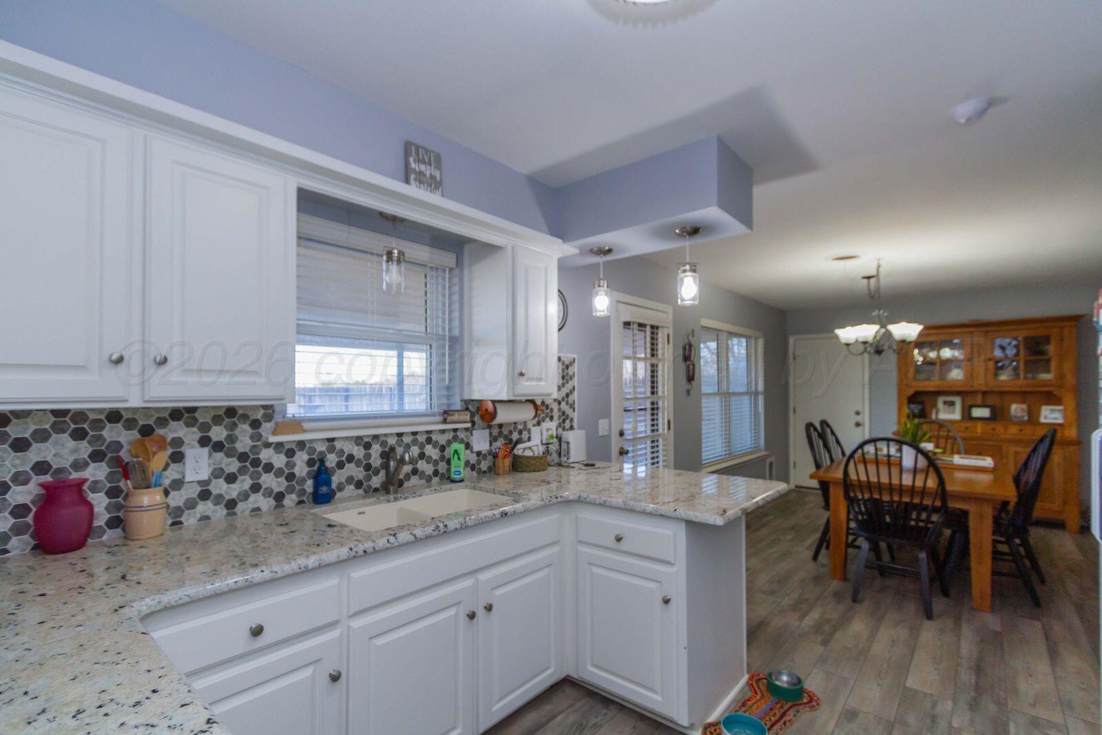7612 Farrell Drive Amarillo, TX 79121 - Photo 8 of 27 a view of a kitchen and dining room
