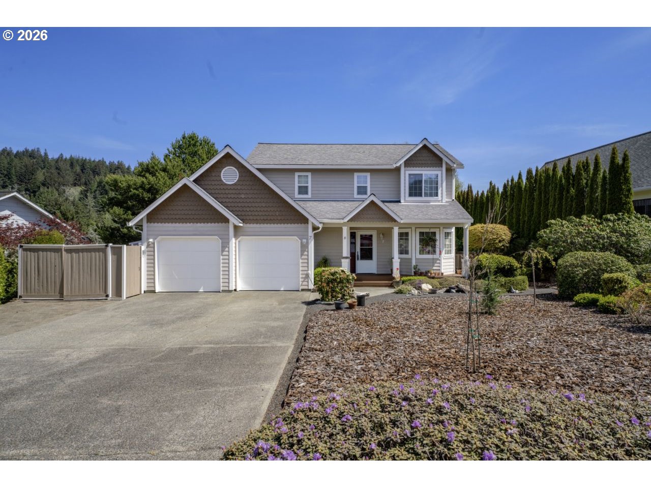 a front view of a house with garden