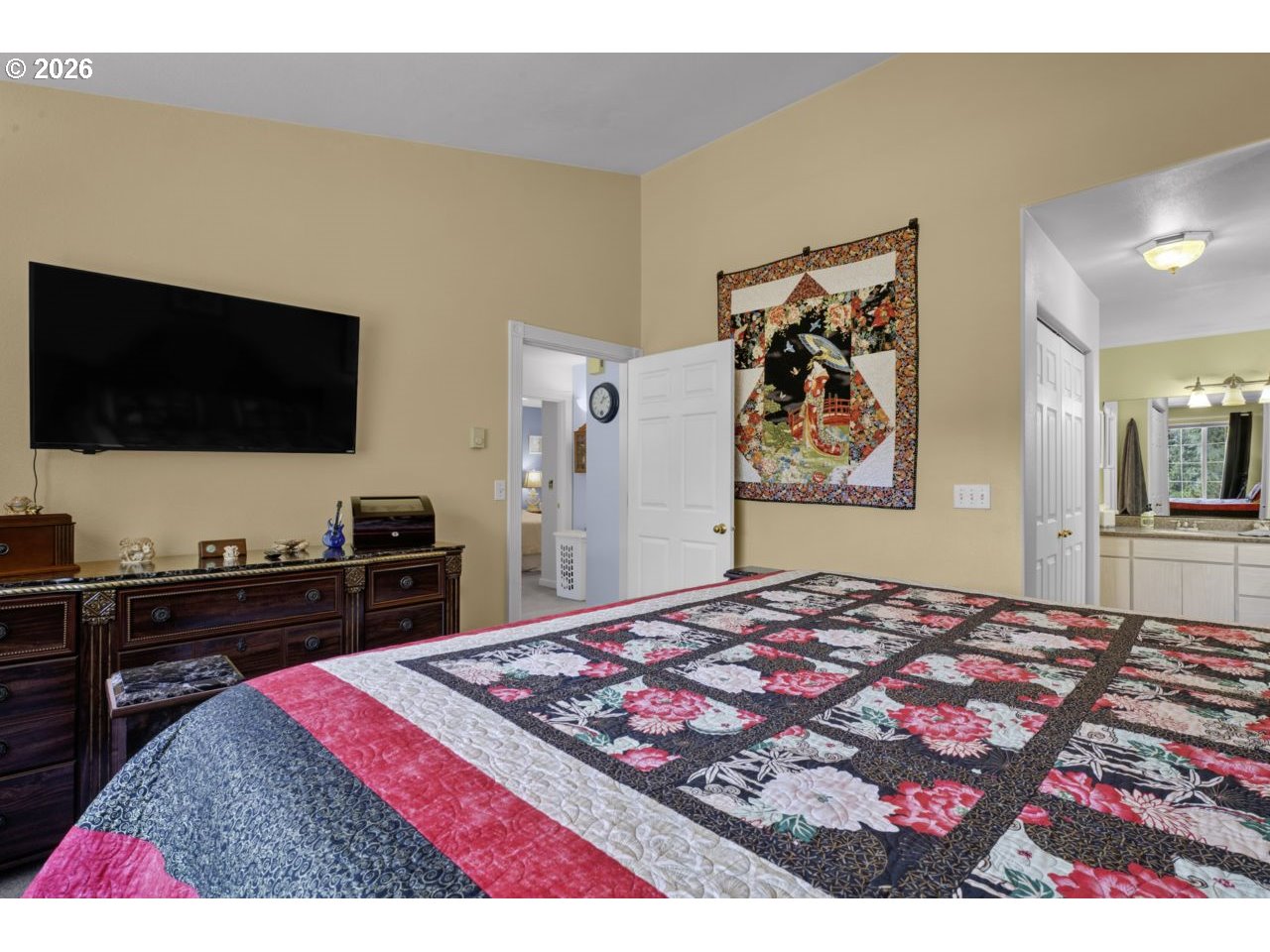 7 Onadoone Court Florence, OR 97439 - Photo 24 of 44 a bedroom with a bed and a flat screen tv