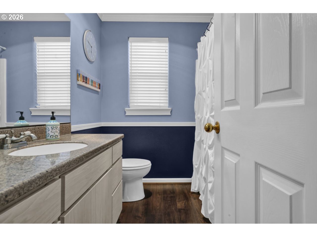 7 Onadoone Court Florence, OR 97439 - Photo 29 of 44 a bathroom with a granite countertop sink a toilet and a mirror