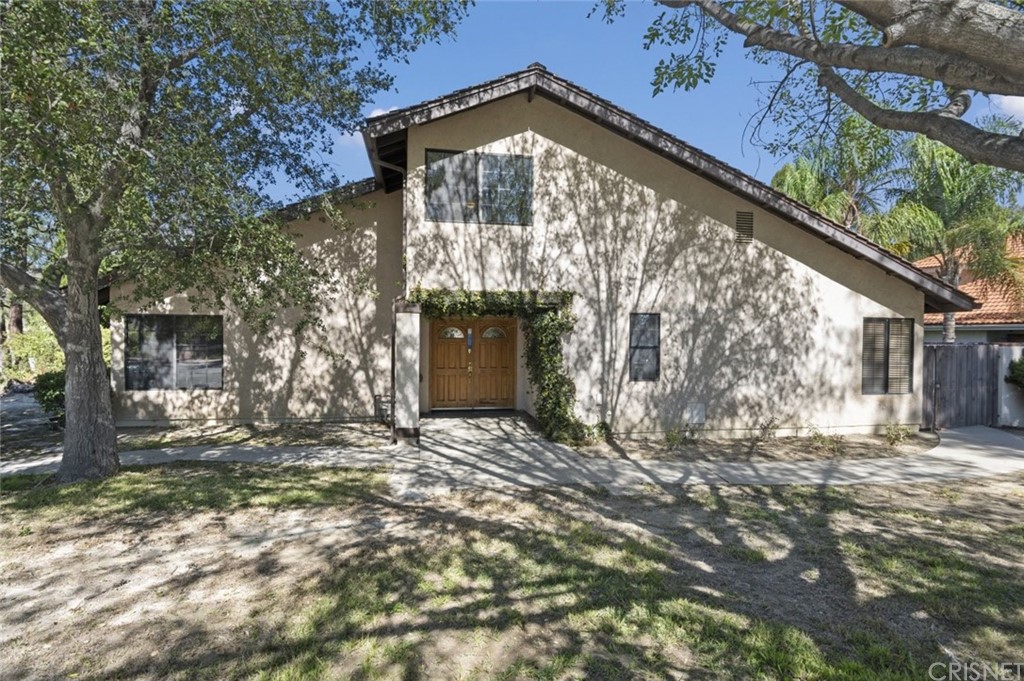 a view of brick house with a large windows
