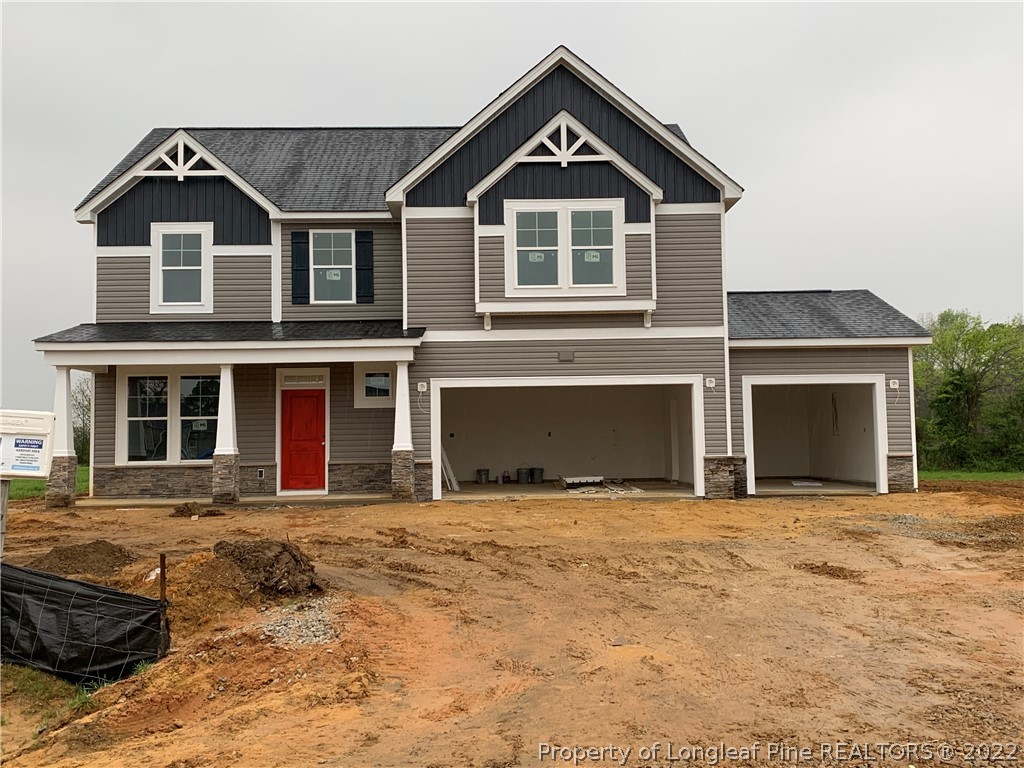 Lot 40 Mill Ridge Godwin, NC 28344 - Photo 1 of 1 a front view of a house with a yard