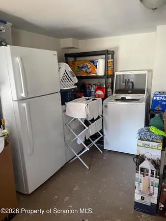 a view of swimming pool with a window and couch