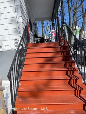 a view of a chair and table in the patio