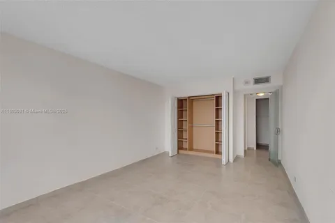 a view of an empty room and closet