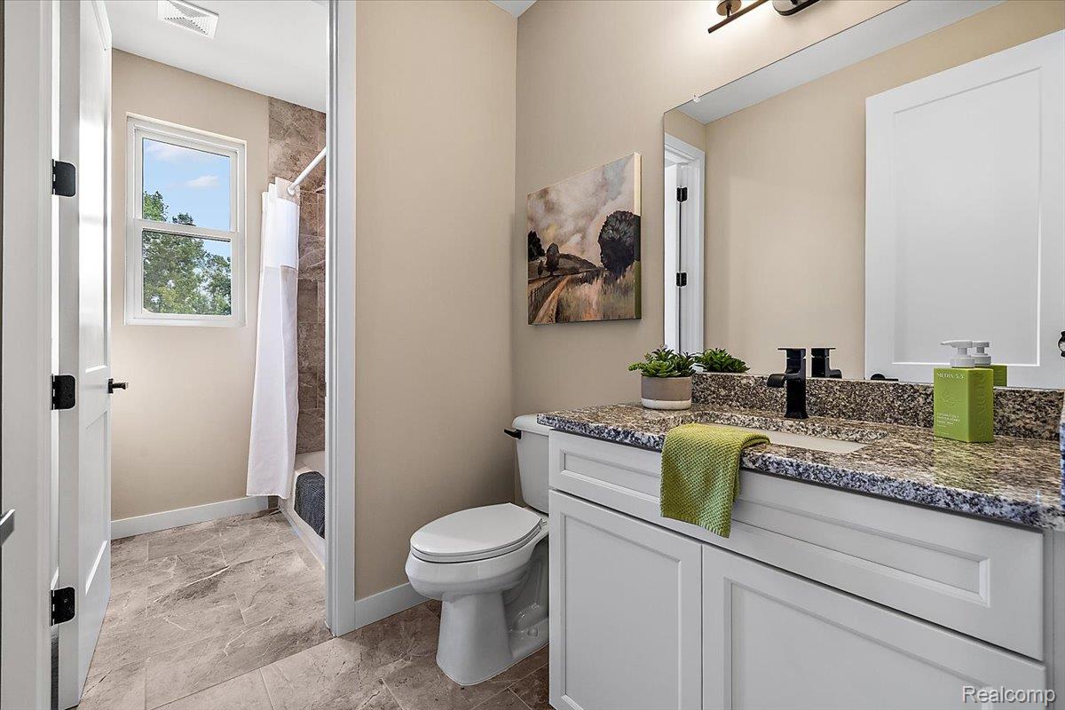 2032 Breckenridge Court, Unit 9 Rochester, MI 48309 - Photo 23 of 39 Full bath featuring vanity and a shower with shower curtain