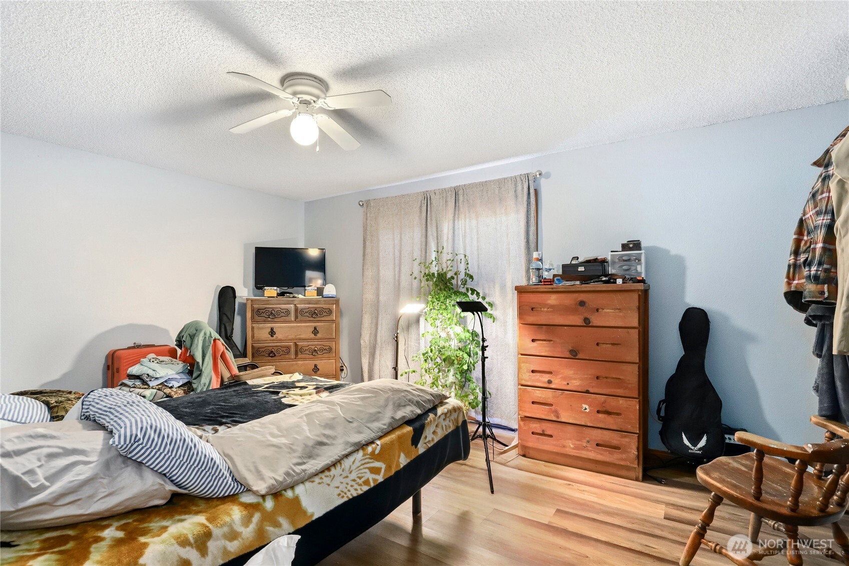 2533 Fir Avenue Bremerton, WA 98310 - Photo 26 of 38 a bedroom with a bed and a flat tv screen on dresser