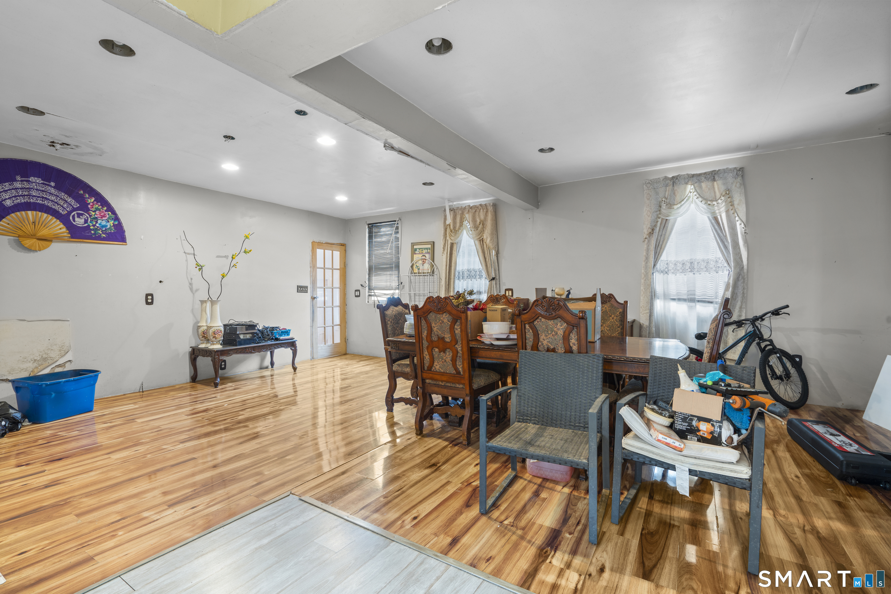 185 Bunker Hill Avenue Waterbury, CT 06708 - Photo 16 of 40 a view of a dining room with furniture and wooden floor