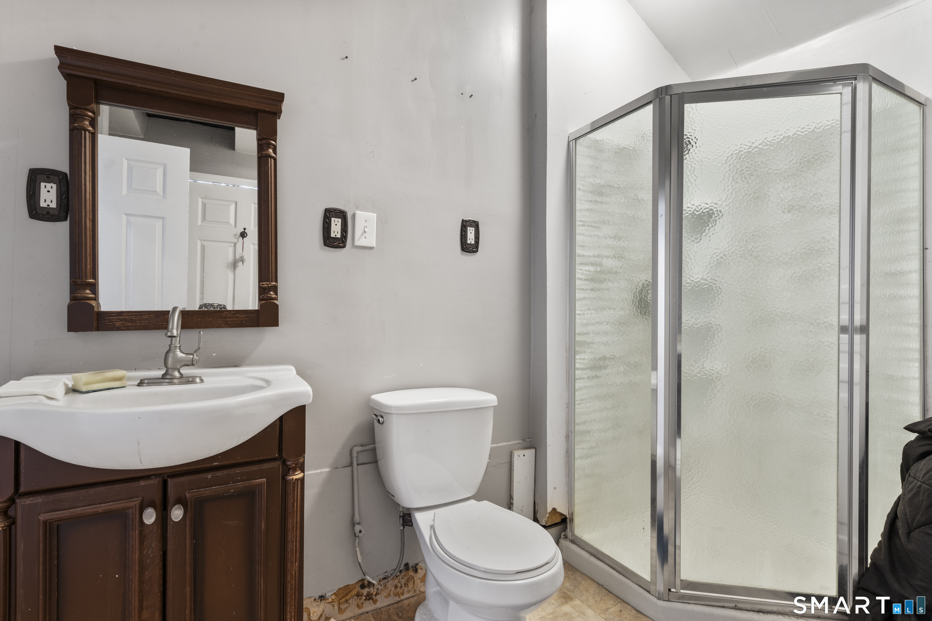 185 Bunker Hill Avenue Waterbury, CT 06708 - Photo 19 of 40 a bathroom with a sink toilet and shower