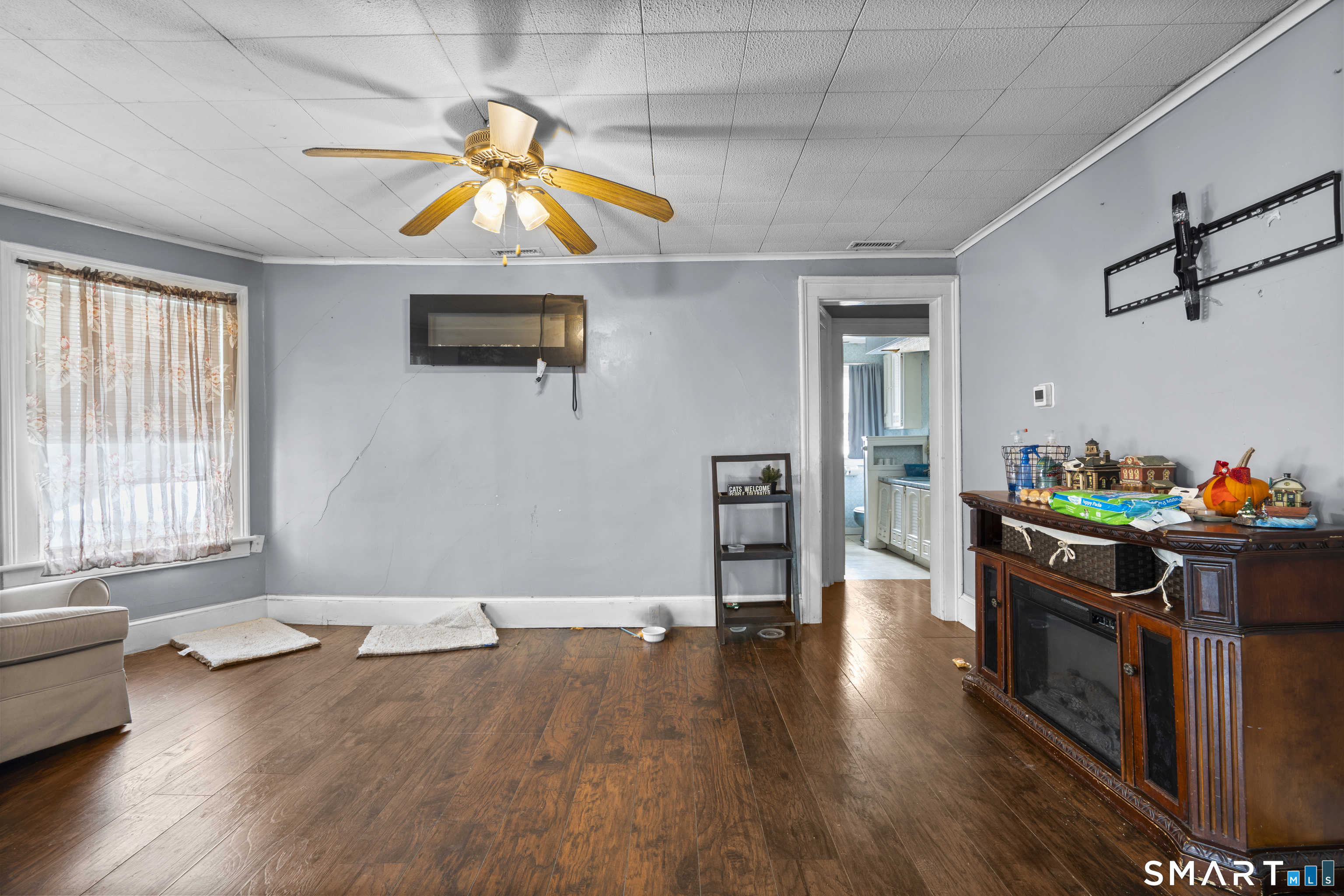 185 Bunker Hill Avenue Waterbury, CT 06708 - Photo 21 of 40 a living room with furniture and a wooden floor
