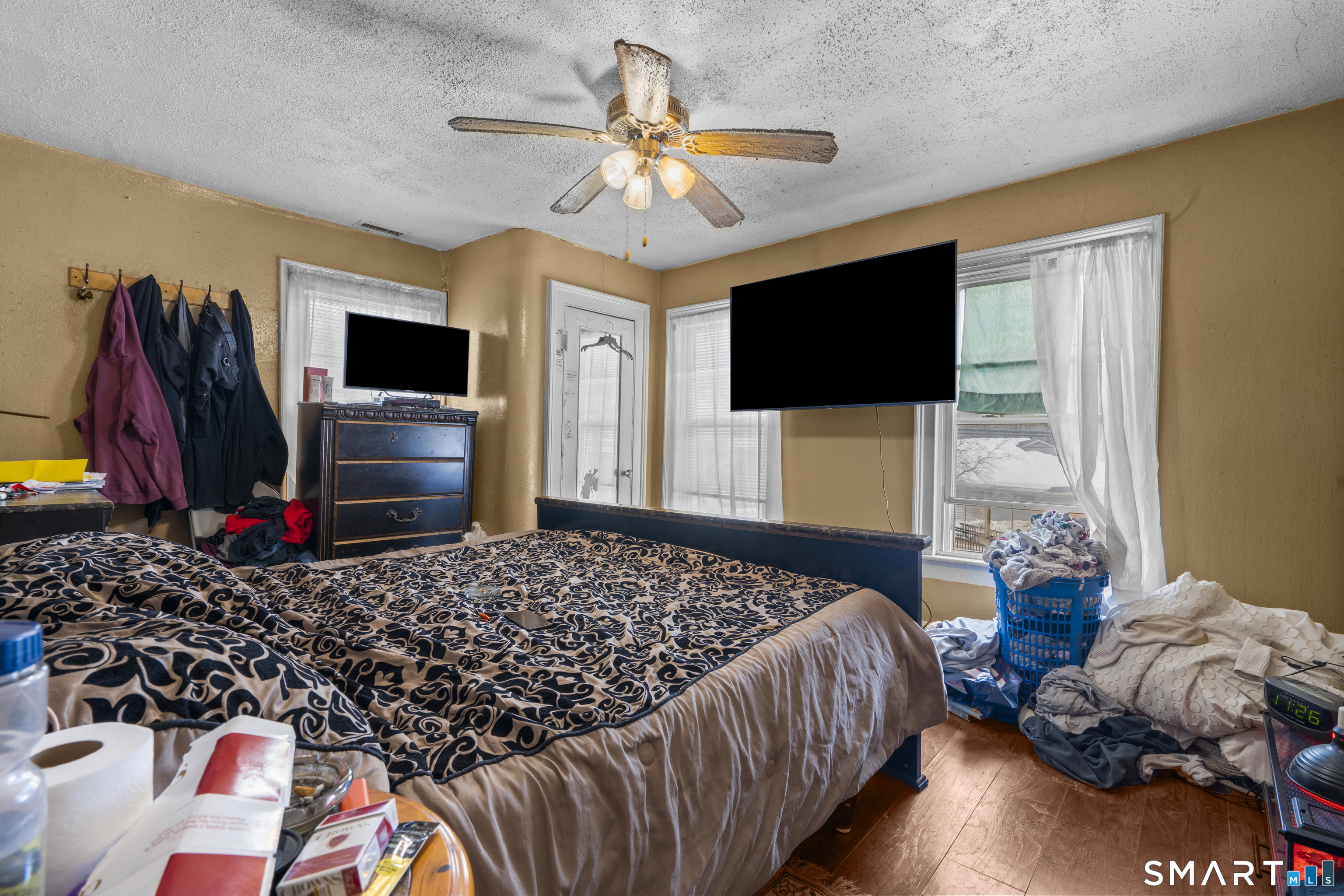 185 Bunker Hill Avenue Waterbury, CT 06708 - Photo 32 of 40 a bedroom with a bed and a flat screen tv