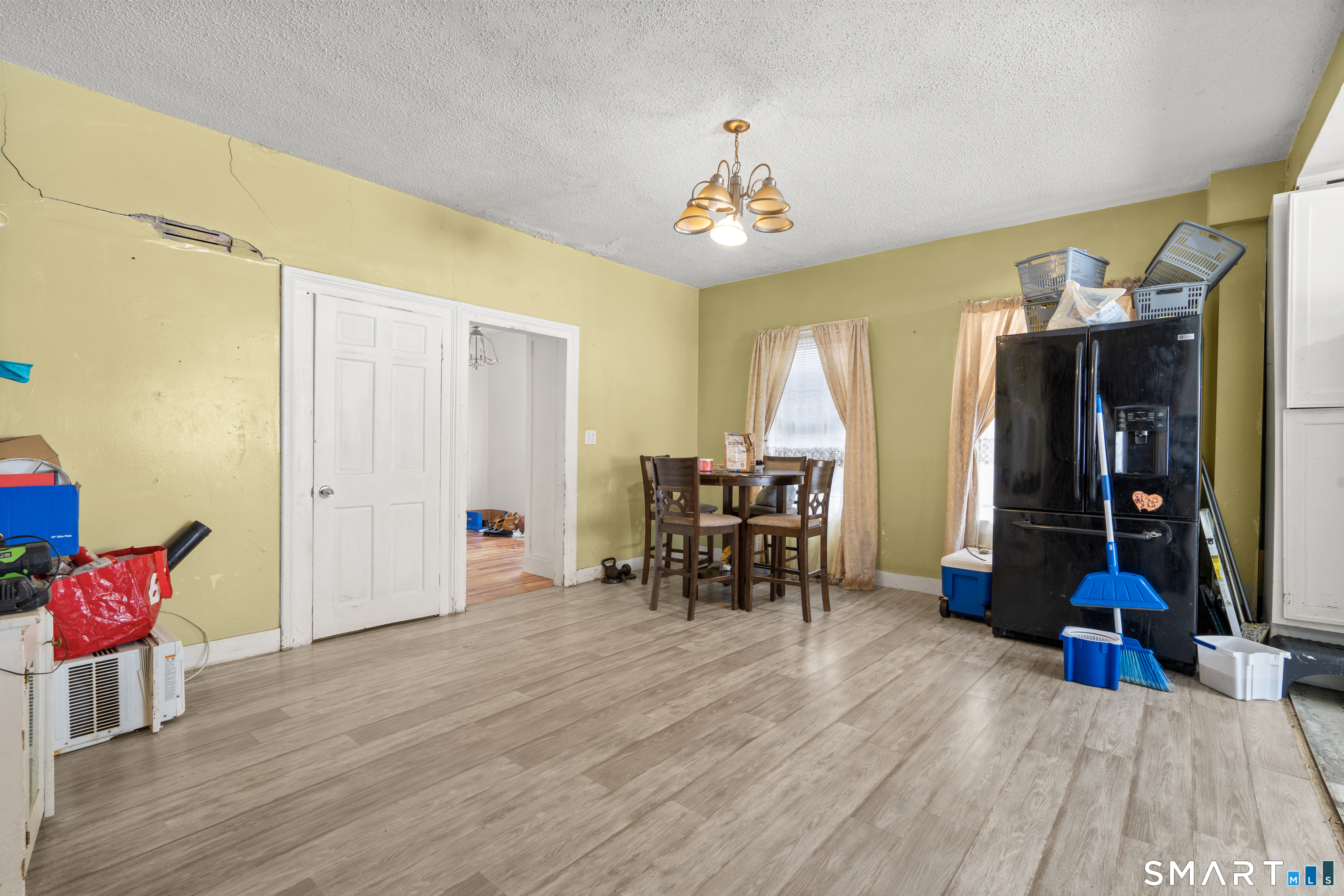 185 Bunker Hill Avenue Waterbury, CT 06708 - Photo 7 of 40 a view of a room with furniture and a chandelier