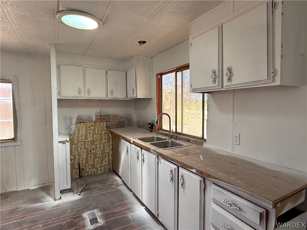 8051 7th Street Dolan Springs, AZ 86441 - Photo 21 of 65 a kitchen with granite countertop a sink and a stove