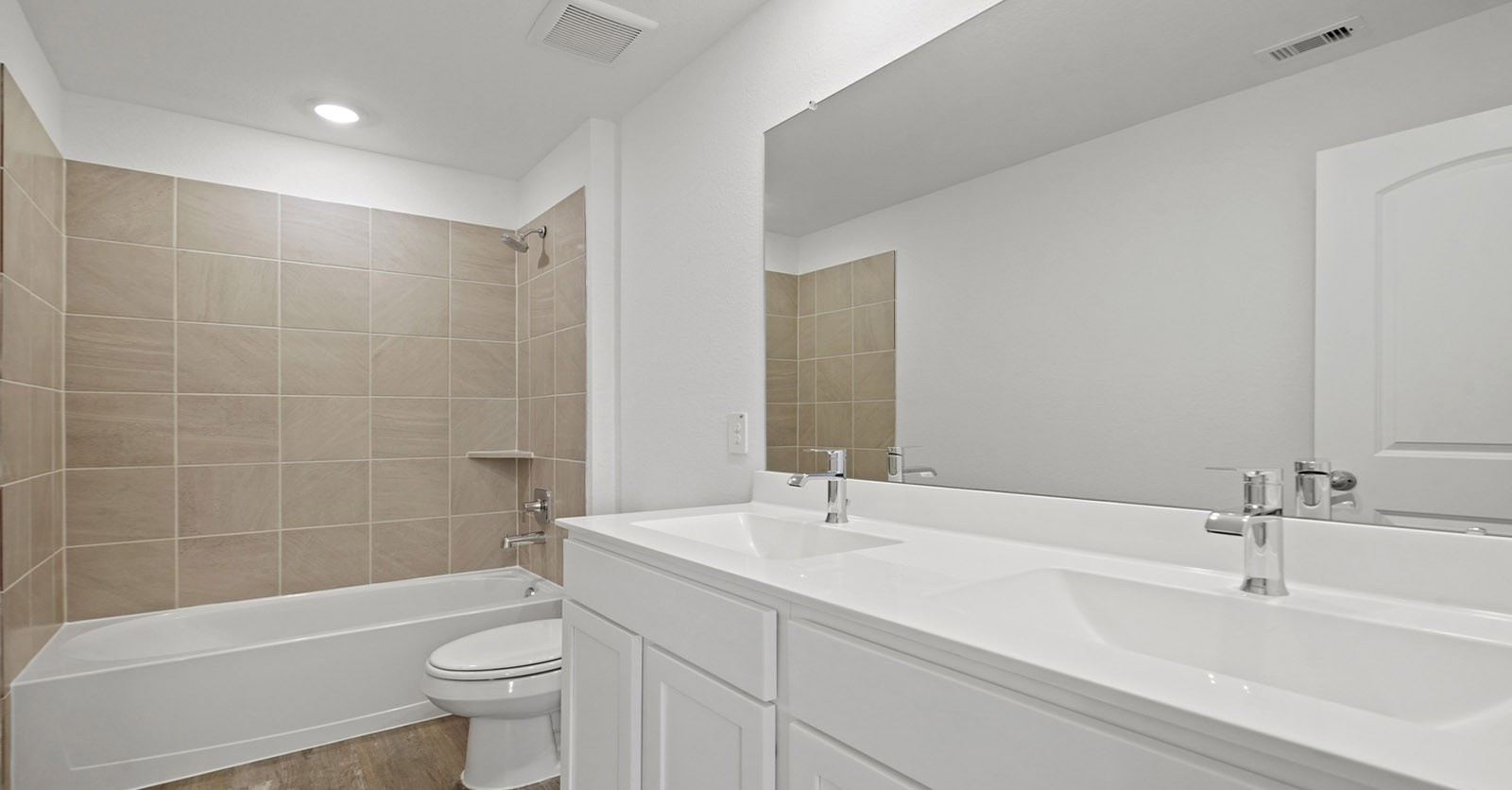 31722 Melkridge Road Fulshear, TX 77441 - Photo 15 of 20 a bathroom with a bathtub shower sink vanity mirror and toilet