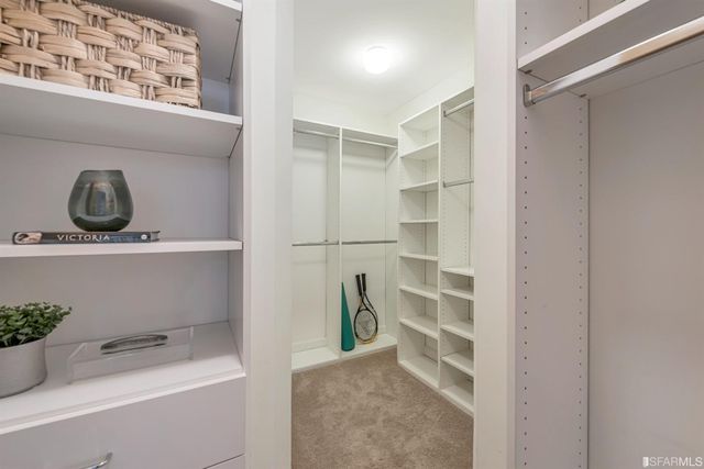 a view of a patio with a table and chairs and potted plants