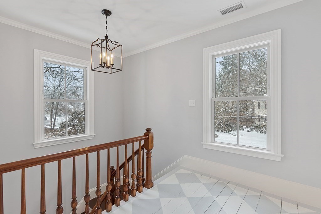 46 Hubbard Street Concord, MA 01742 - Photo 13 of 24 a view of a room with window wooden floor and chandelier