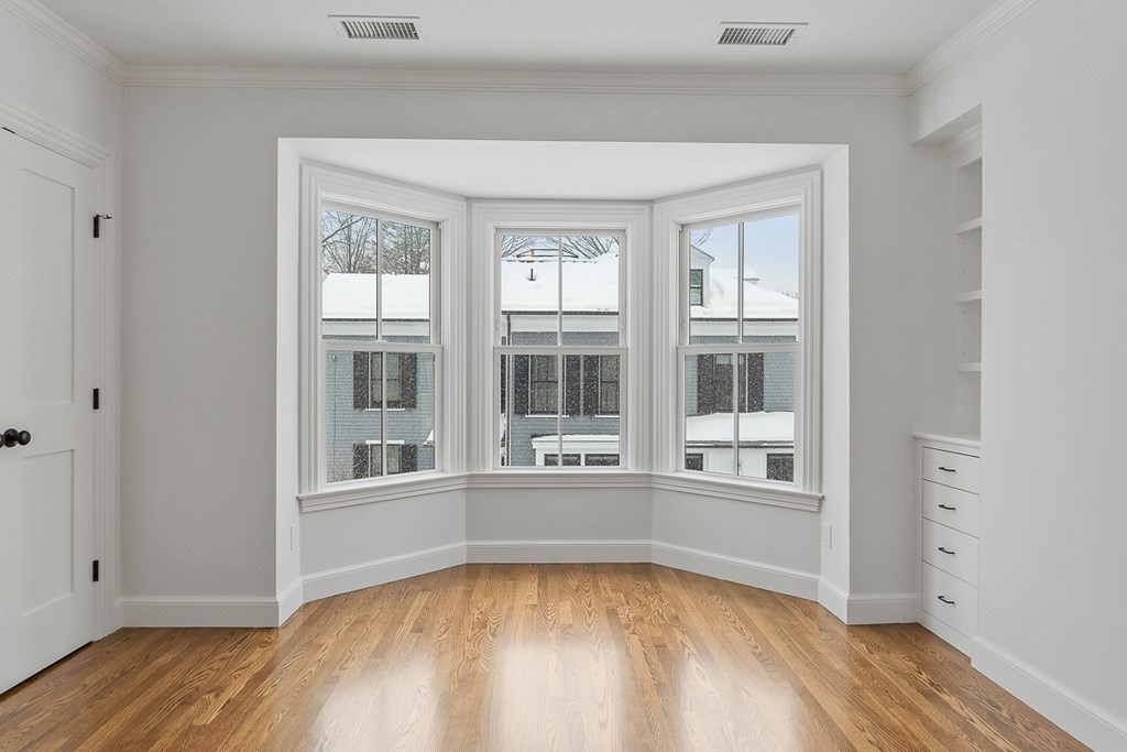 46 Hubbard Street Concord, MA 01742 - Photo 14 of 24 wooden floor in an empty room with a window