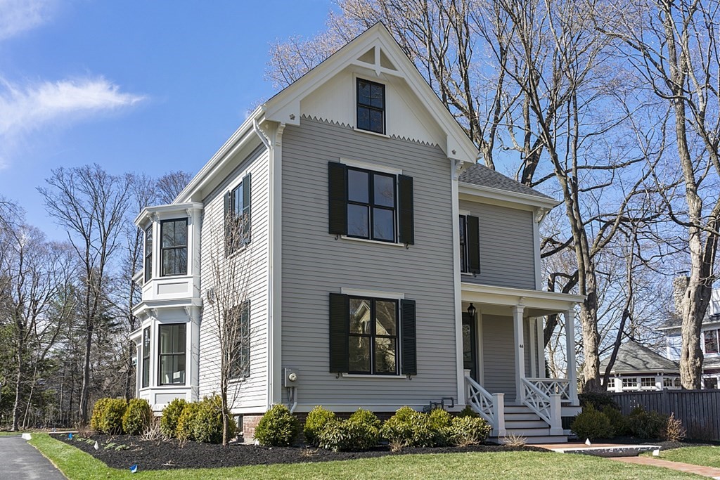 46 Hubbard Street Concord, MA 01742 - Photo 2 of 24 a front view of a house with garden