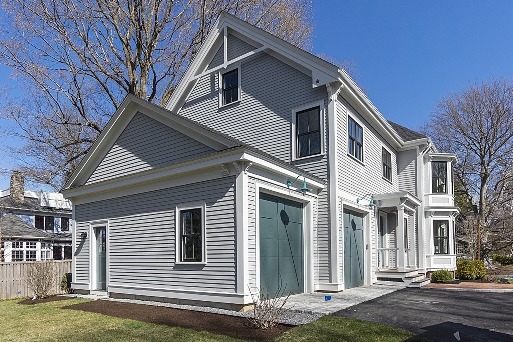 46 Hubbard Street Concord, MA 01742 - Photo 22 of 24 a view of a white house with a large windows