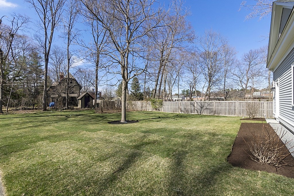 46 Hubbard Street Concord, MA 01742 - Photo 23 of 24 a view of a yard with a house