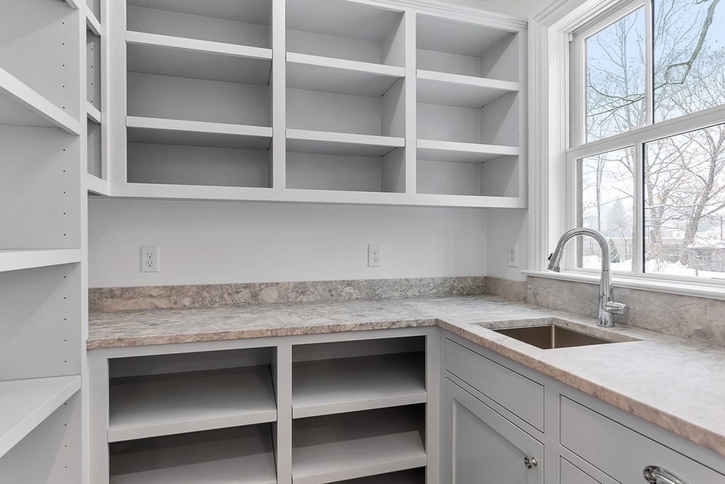 46 Hubbard Street Concord, MA 01742 - Photo 6 of 24 a kitchen with a sink and cabinets