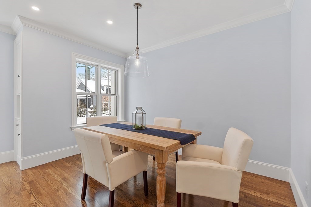 46 Hubbard Street Concord, MA 01742 - Photo 9 of 24 a view of a dining room with furniture and wooden floor