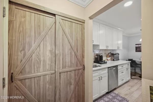 a kitchen with a white cabinets and white appliances
