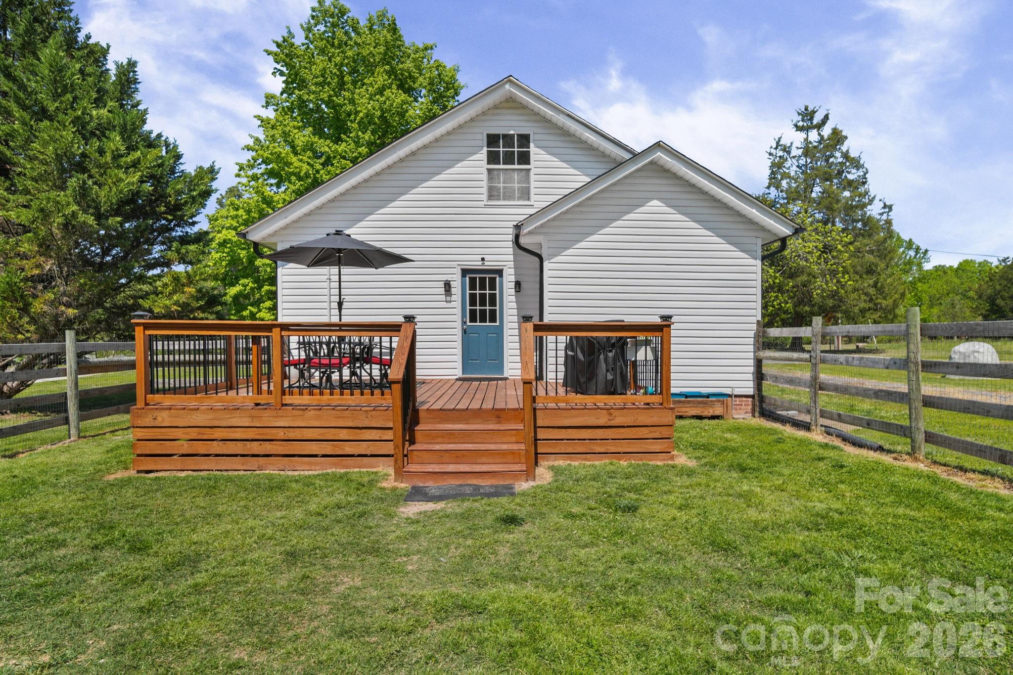9215 Stokes Ferry Road Salisbury, NC 28146 - Photo 21 of 22 a front view of a house with a yard
