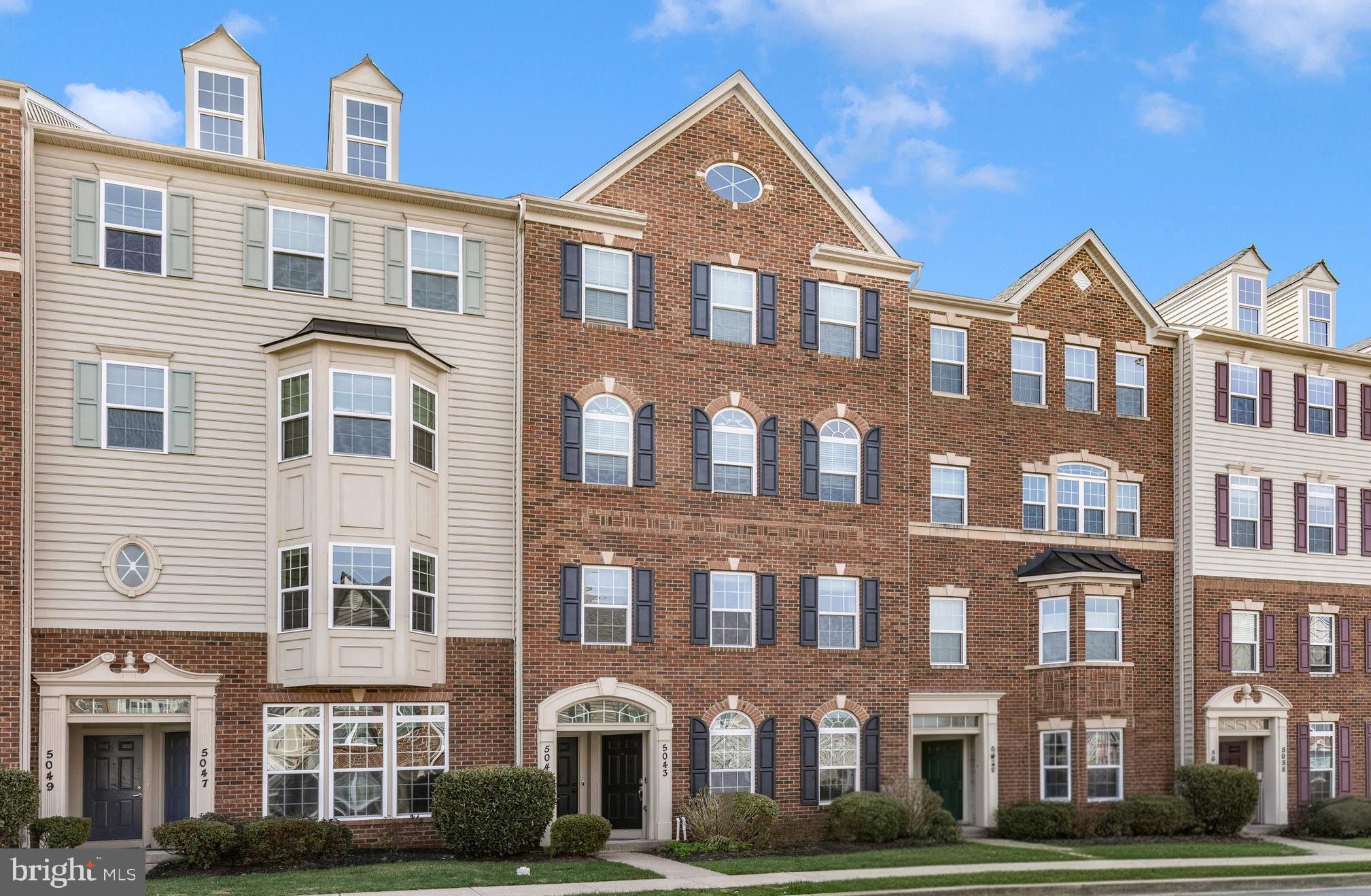 5043 Small Gains Way Frederick, MD 21703 - Photo 1 of 44 a front view of a building with lot of windows