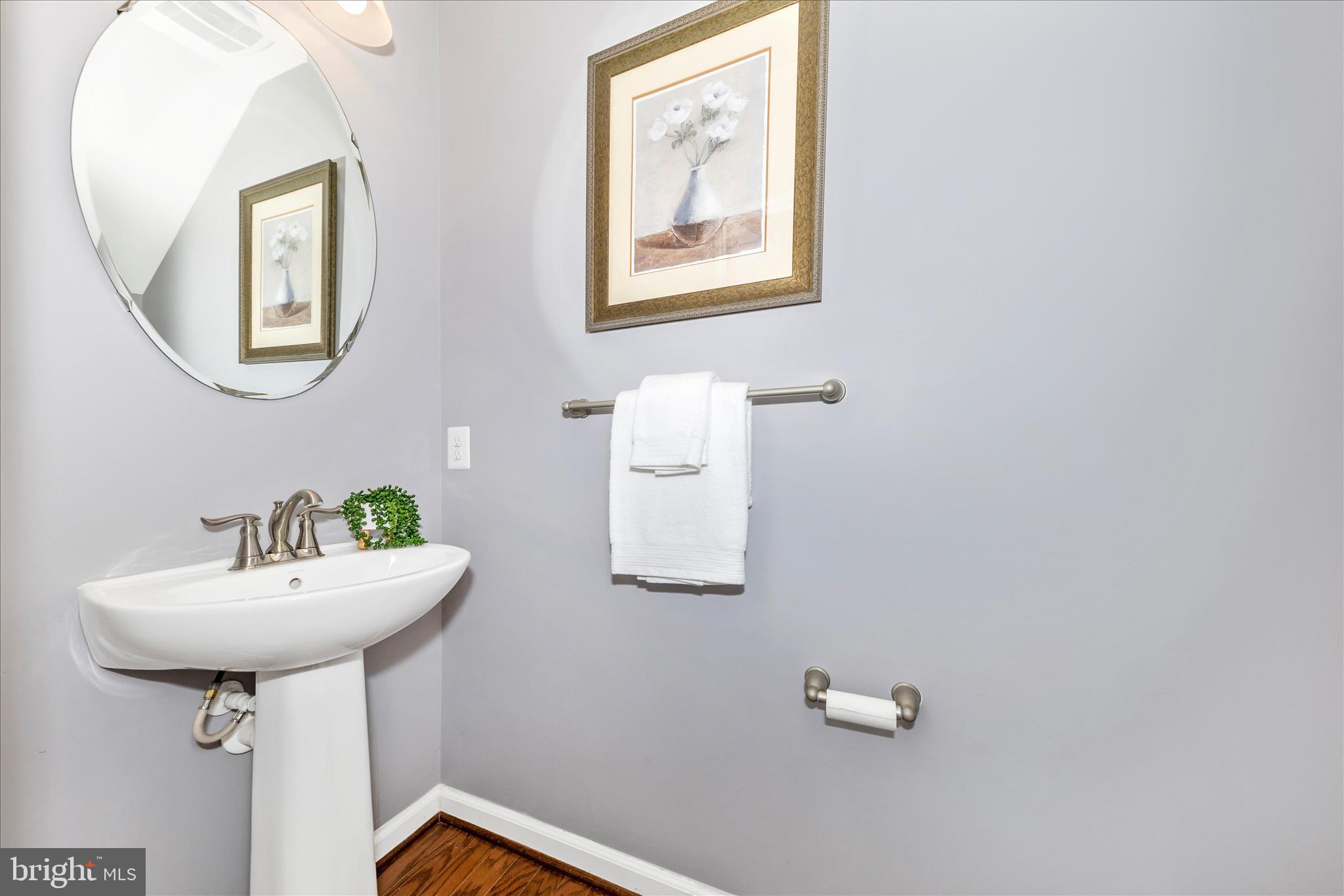 5043 Small Gains Way Frederick, MD 21703 - Photo 11 of 44 a bathroom with a sink mirror and toilet