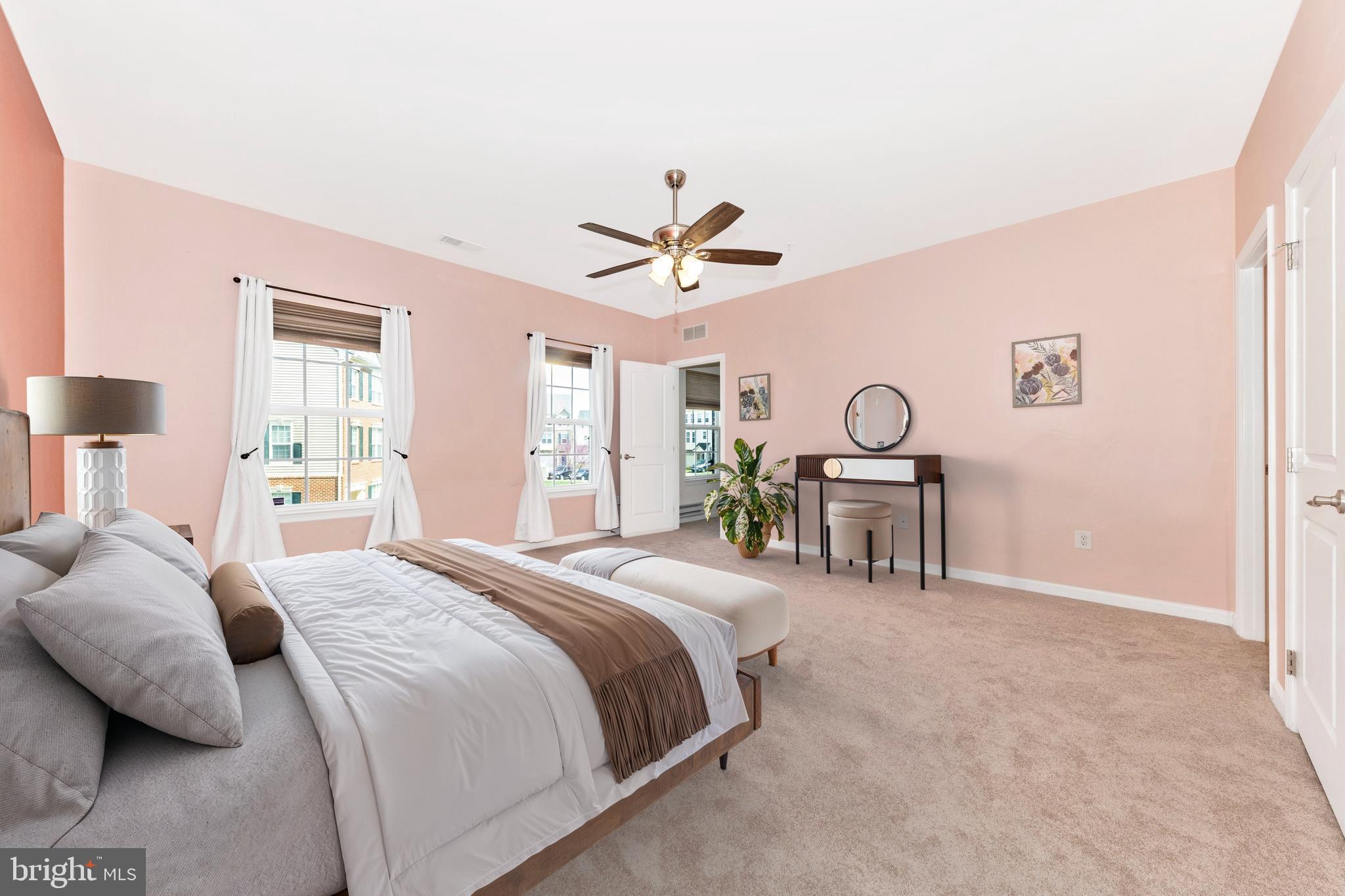5043 Small Gains Way Frederick, MD 21703 - Photo 14 of 44 a bedroom with a bed and a chandelier