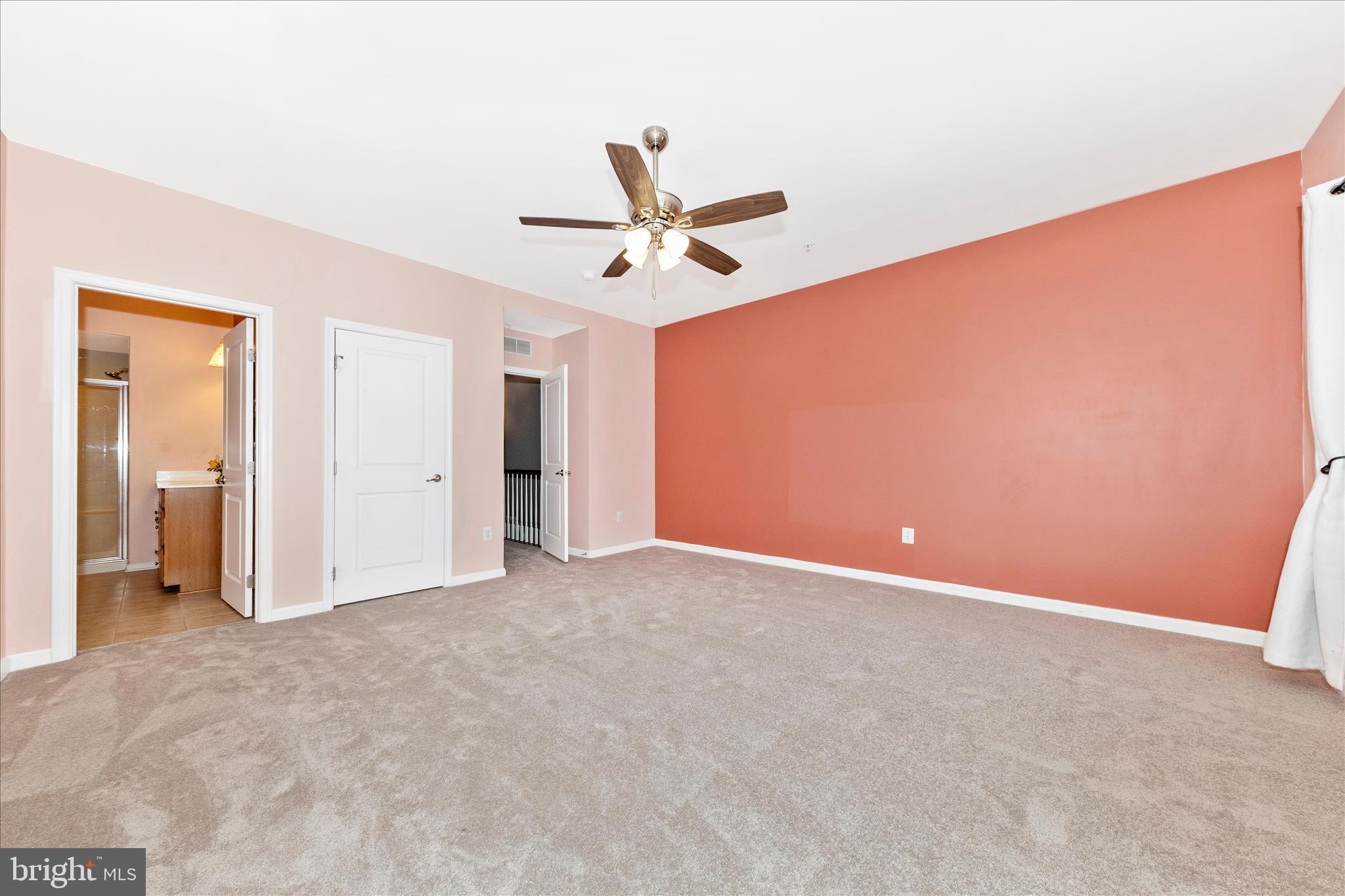 5043 Small Gains Way Frederick, MD 21703 - Photo 16 of 44 an empty room with closet and a ceiling fan