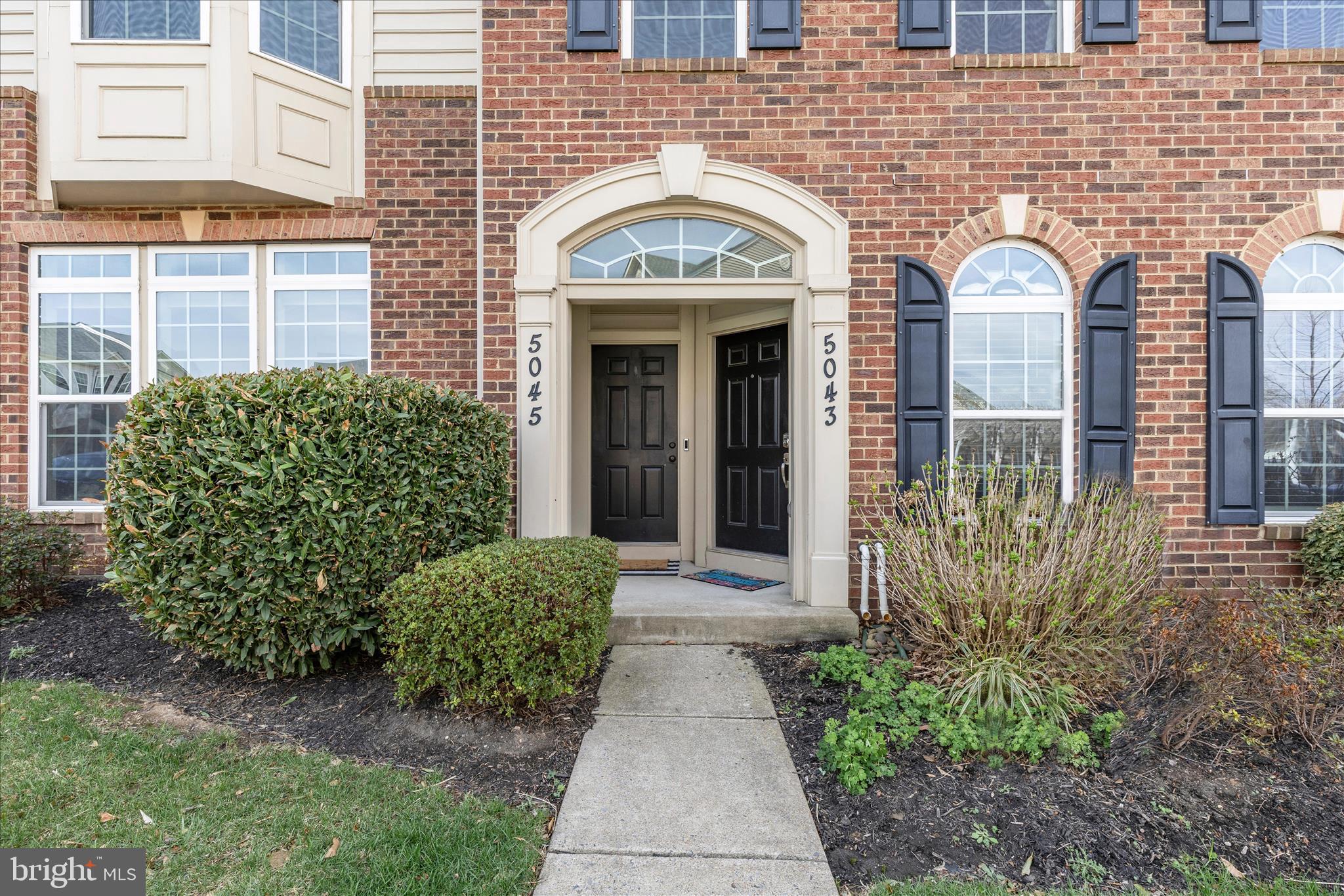 5043 Small Gains Way Frederick, MD 21703 - Photo 2 of 44 a front view of a house with garden