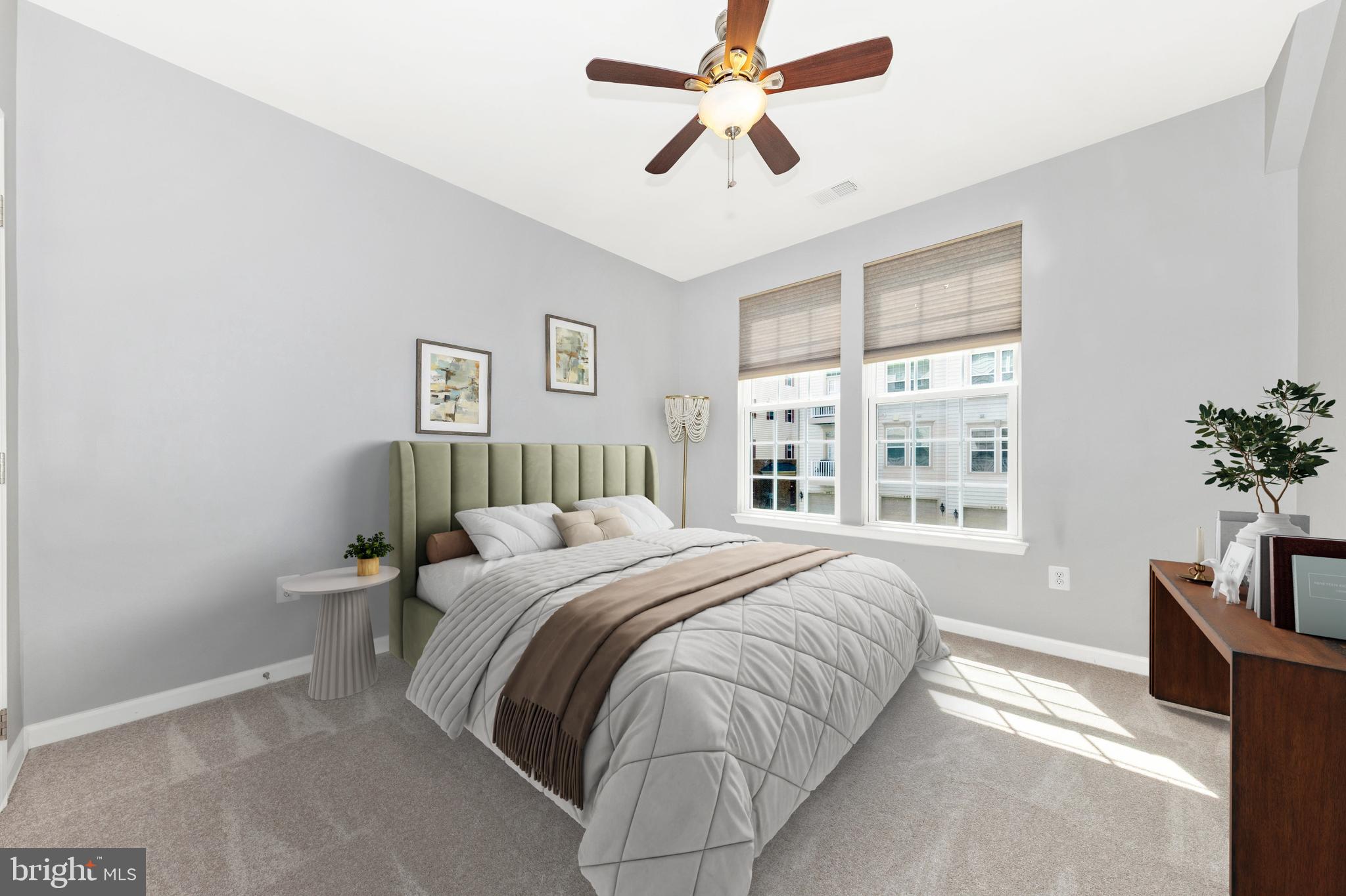 5043 Small Gains Way Frederick, MD 21703 - Photo 21 of 44 a bedroom with a large bed and a chandelier fan