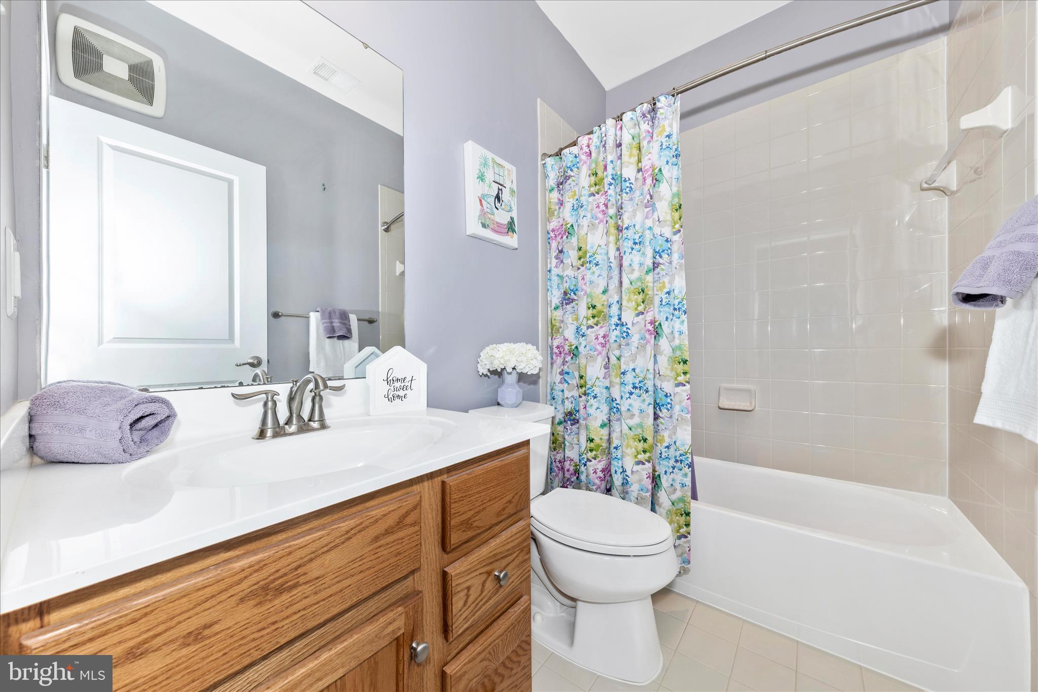 5043 Small Gains Way Frederick, MD 21703 - Photo 24 of 44 a bathroom with a sink a toilet and shower