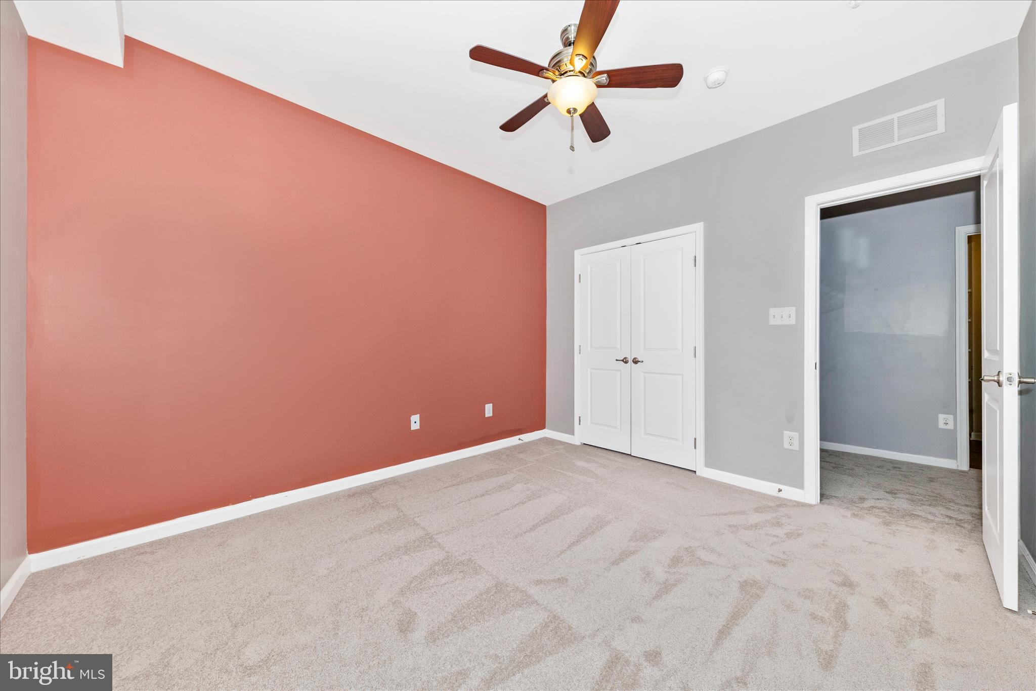 5043 Small Gains Way Frederick, MD 21703 - Photo 28 of 44 an empty room with closet and a ceiling fan