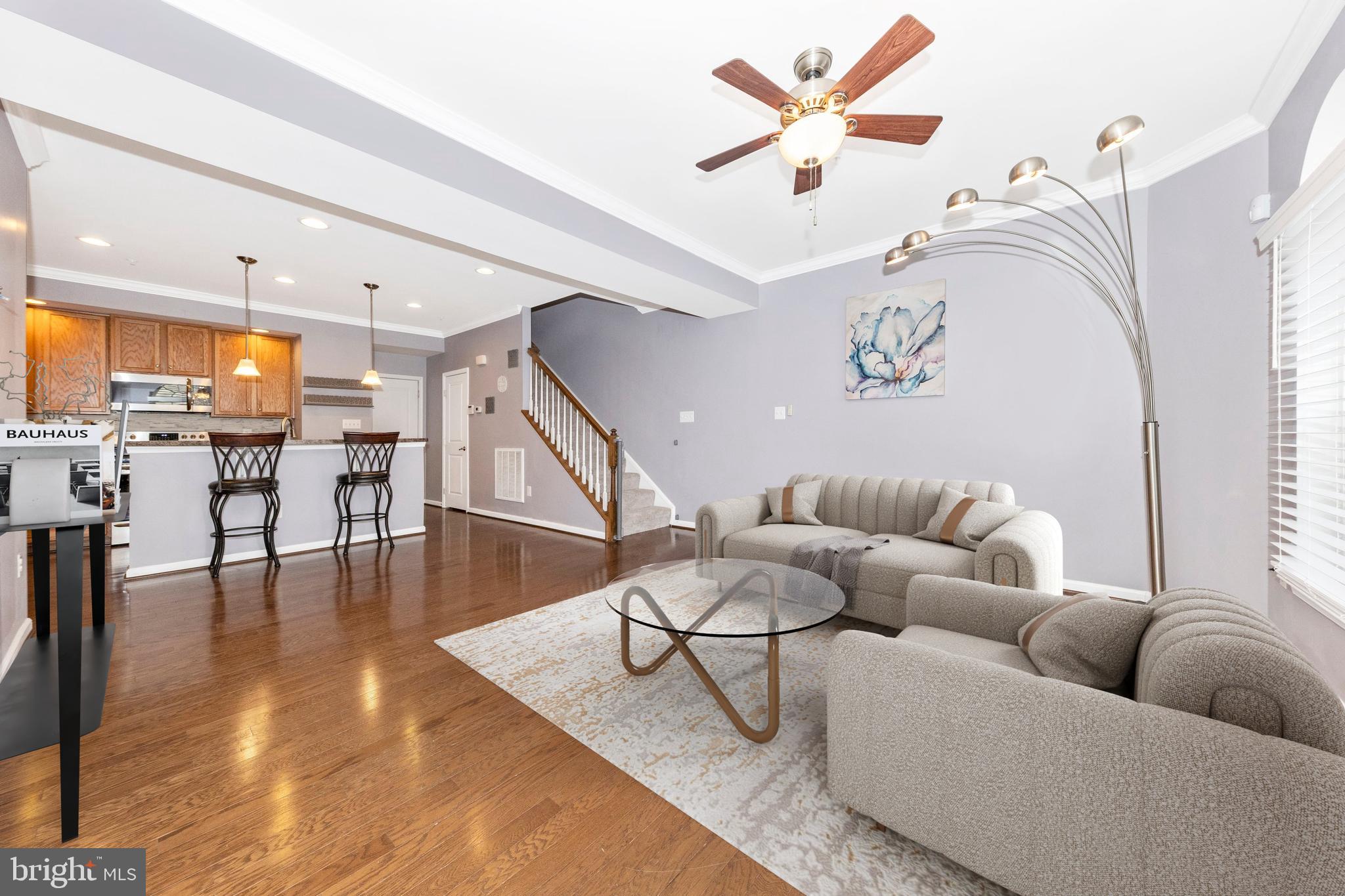 5043 Small Gains Way Frederick, MD 21703 - Photo 3 of 44 a living room with furniture and wooden floor