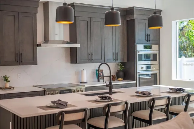 a bathroom with a double vanity sink toilet and shower