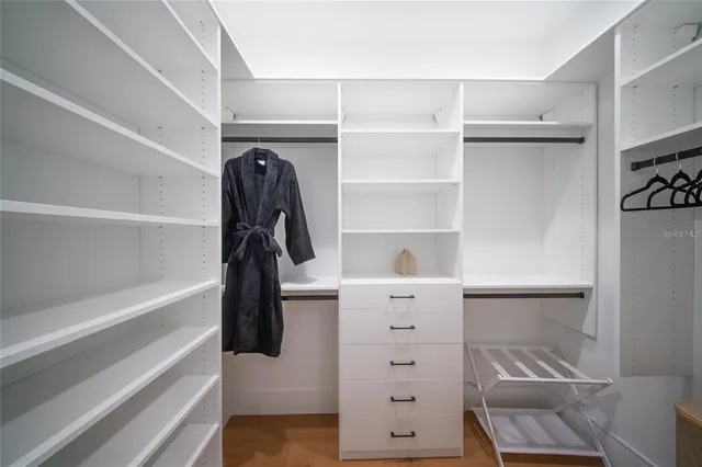 a bathroom with a toilet sink and a mirror