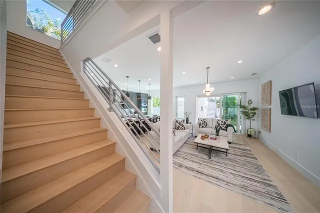 a bedroom with a bed and a mirror