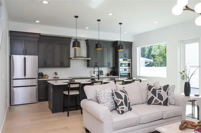 a kitchen with a table chairs and a stove