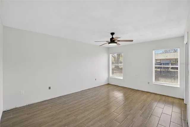 an aerial view of a house with garden space and street view