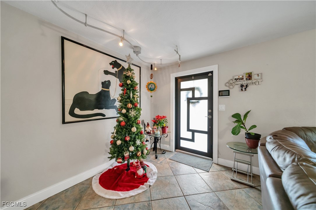 17255 Southwest 299th Street Homestead, FL 33030 - Photo 16 of 47 a floor to ceiling window and potted plant