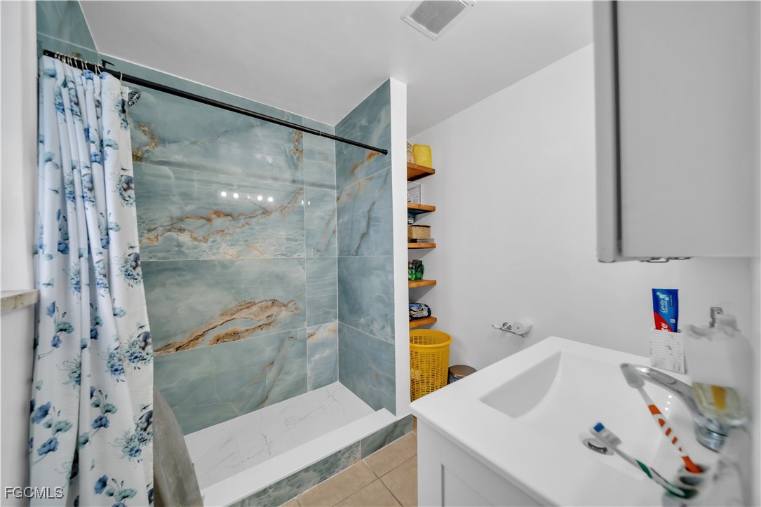 17255 Southwest 299th Street Homestead, FL 33030 - Photo 26 of 47 a bathroom with a sink and a shower