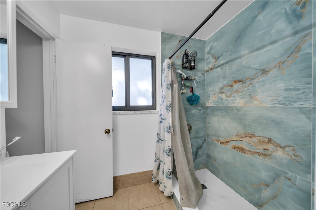 17255 Southwest 299th Street Homestead, FL 33030 - Photo 27 of 47 a bathroom with a bathtub and shower