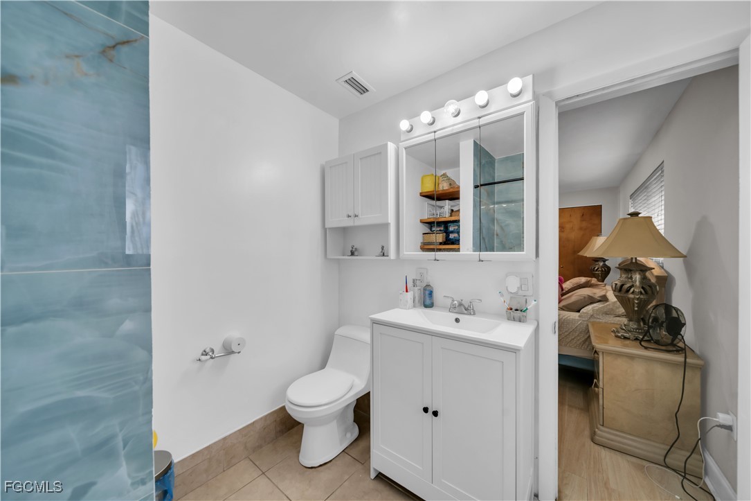 17255 Southwest 299th Street Homestead, FL 33030 - Photo 28 of 47 a bathroom with a sink and a mirror