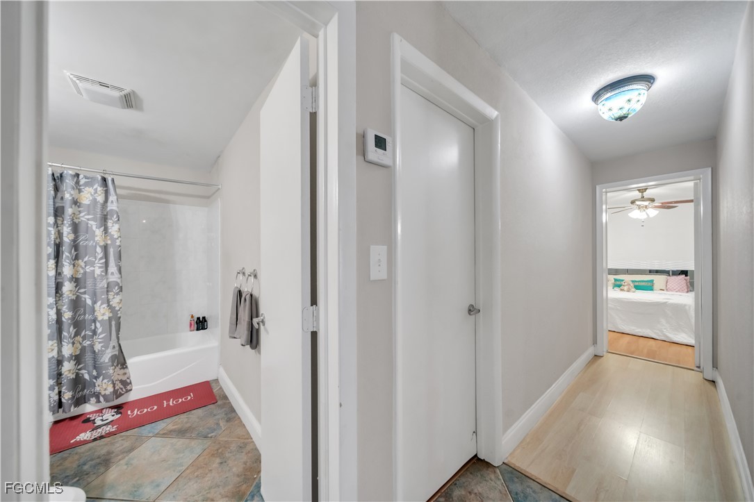 17255 Southwest 299th Street Homestead, FL 33030 - Photo 31 of 47 a bathroom with a bathtub and shower